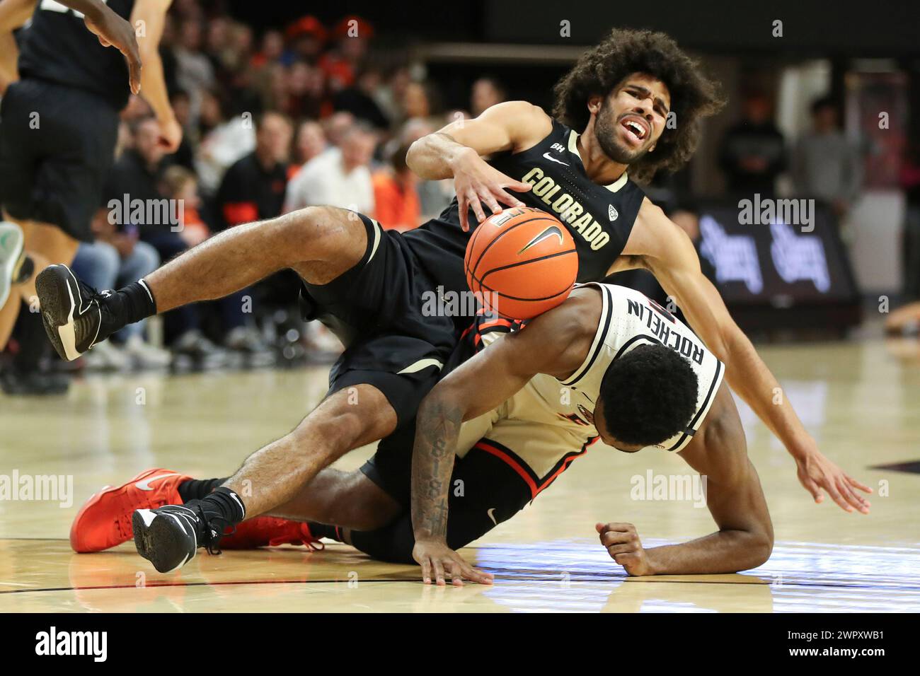 Colorado guard Javon Ruffin, top, and Oregon State guard Justin ...