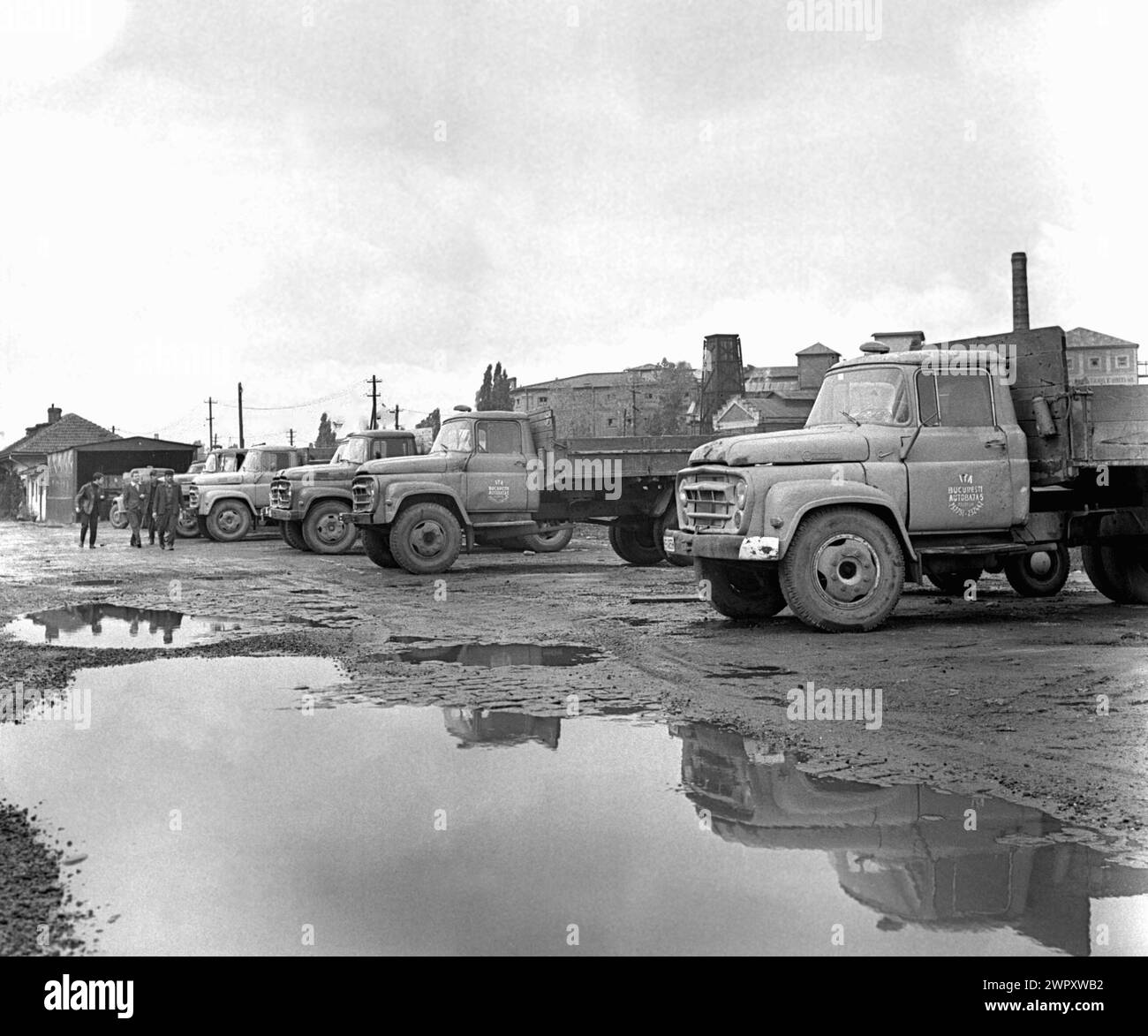 Trucks parked at a  State Agricultural Enterprise (I.A.S.) in communist Romania, in the 1970s Stock Photo