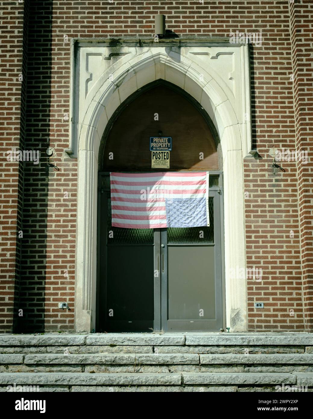 Upside-down American flag on St. Mary of Assumption Church, Coaldale, Pennsylvania Stock Photo