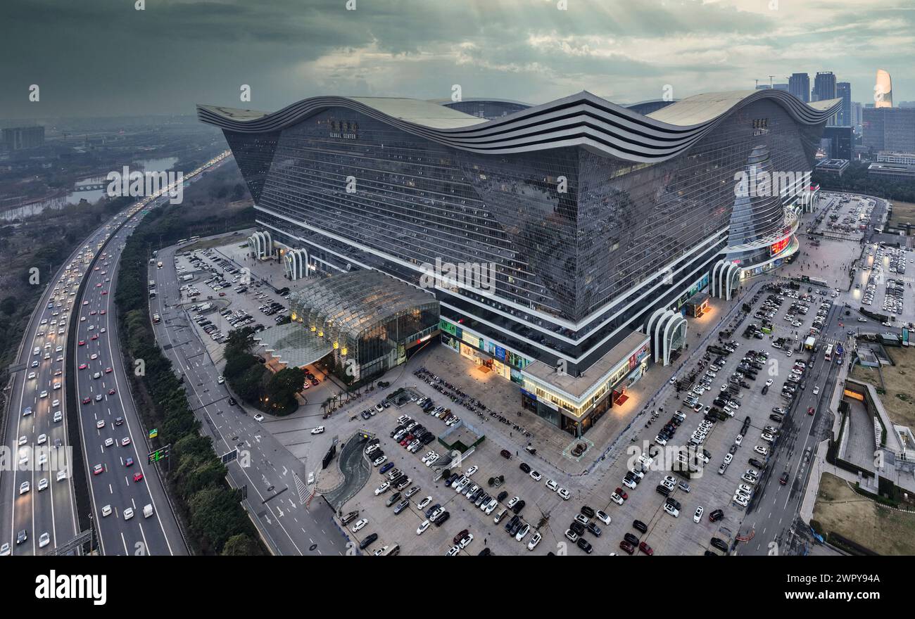 March 6, 2024 - Chengdu, Sichuan: Aerial view of SKP towers and New Century Global Center Mall at night Stock Photo