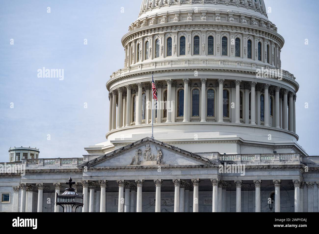 U.S. Capitol Building close-up with American Flag Flying. Stock Photo