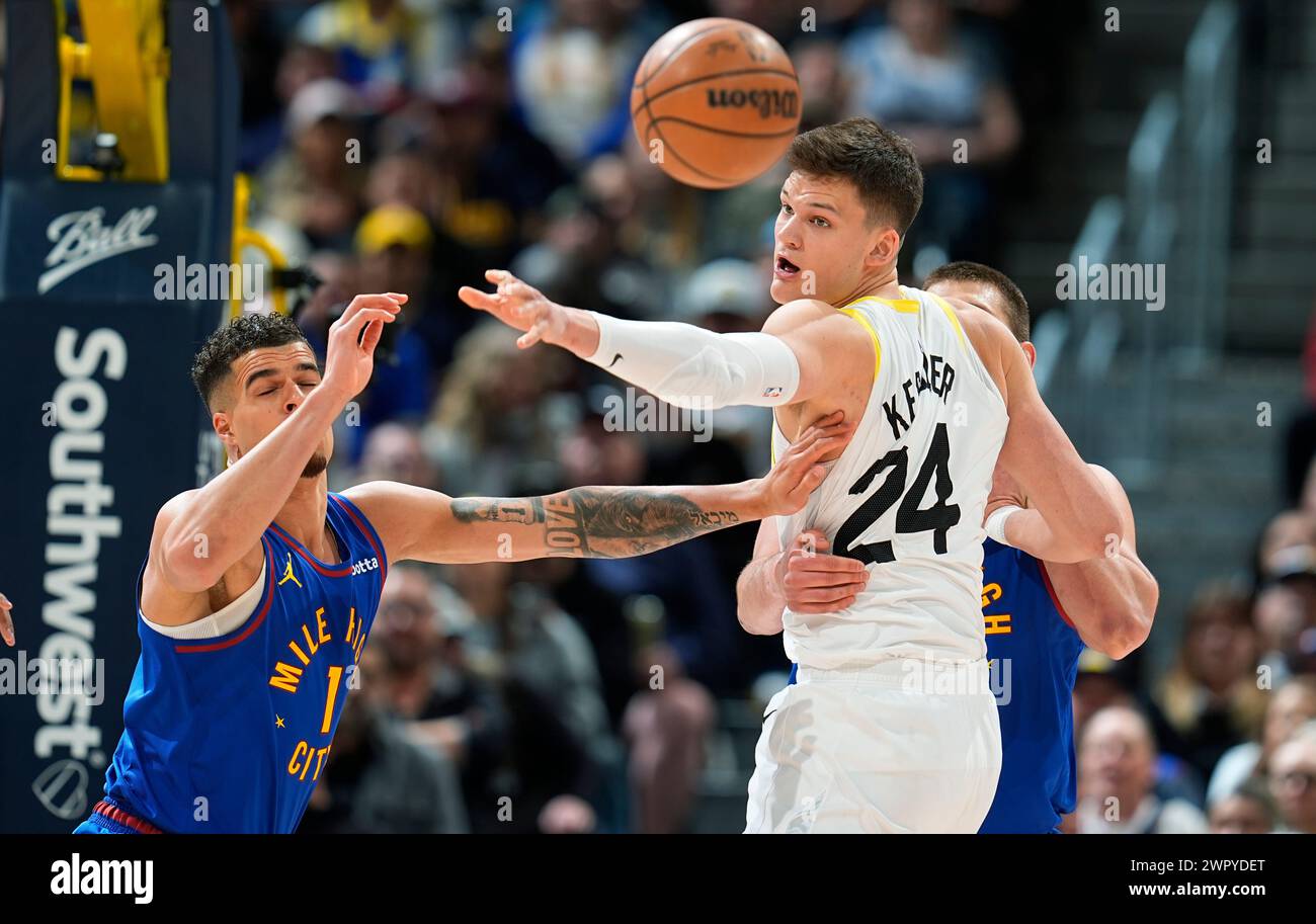 Utah Jazz center Walker Kessler, right, and Denver Nuggets center Nikola Jokic, back right, and