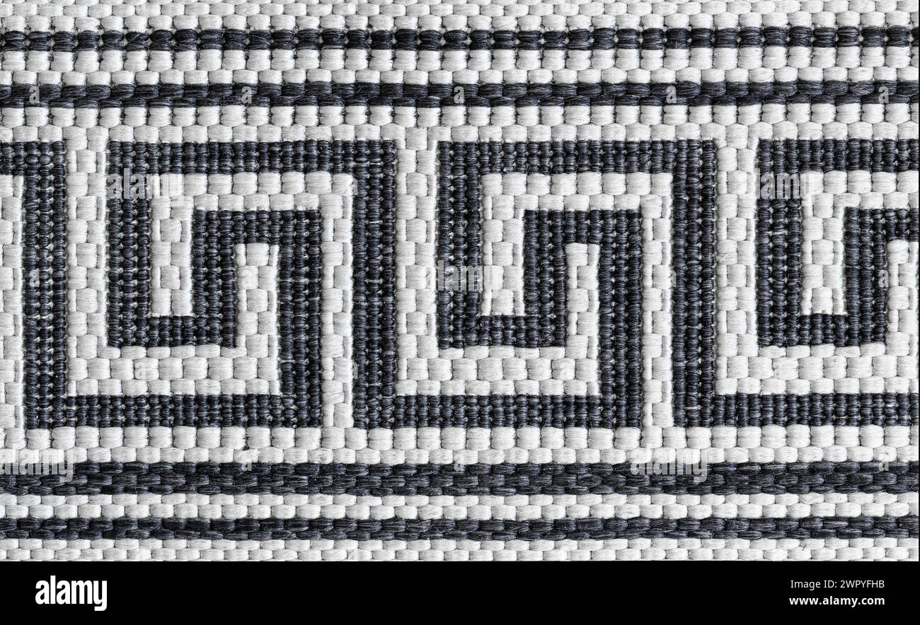 Abstract pattern of woven rug. Geometric pattern. Macro photography. Stock Photo