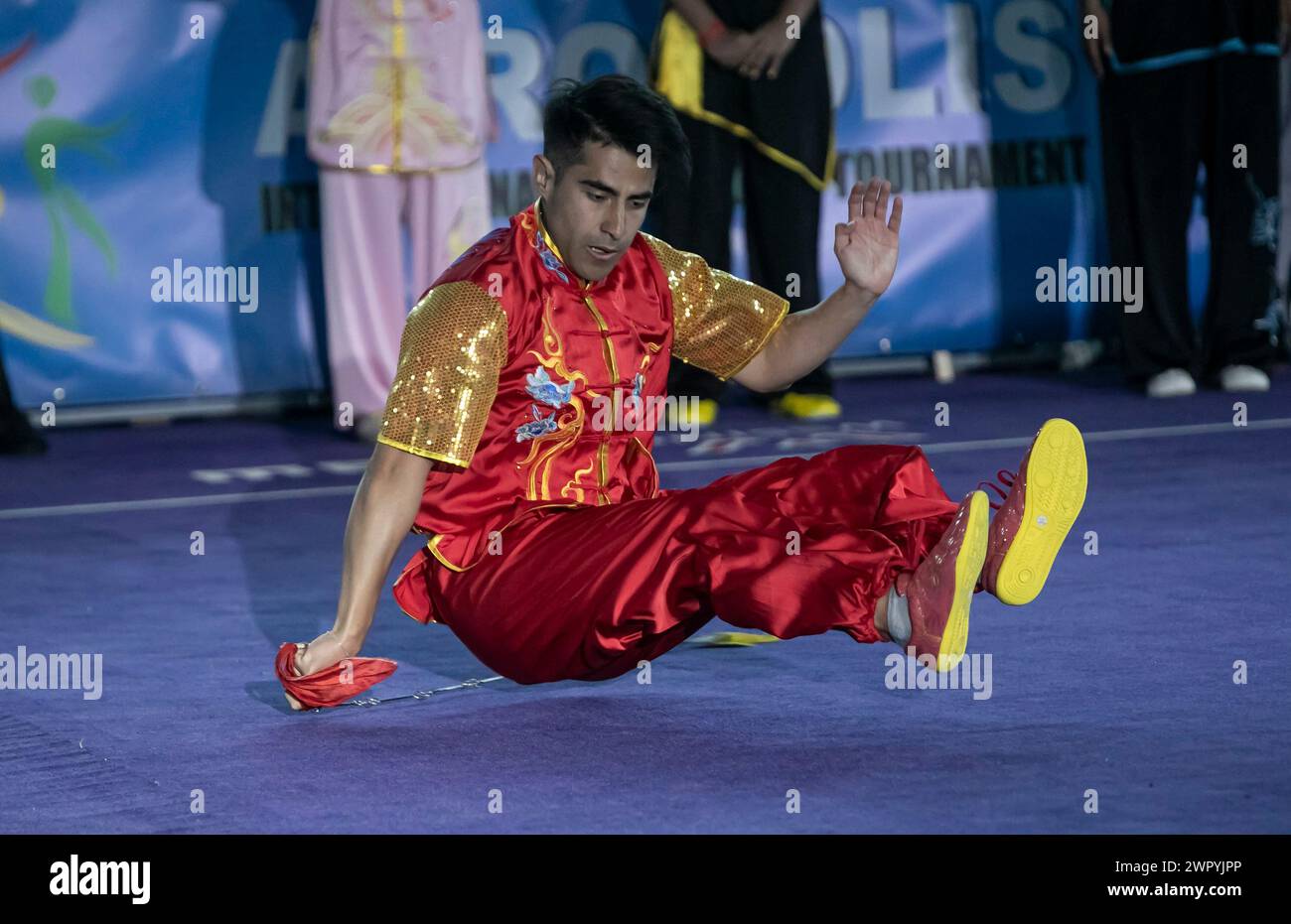 Greece, Greece. 9th Mar, 2024. An athlete performs during the opening ceremony of the Acropolis-Forbidden City International Wushu Tournament in Athens, Greece, on March 9, 2024. Credit: Panagiotis Moschandreou/Xinhua/Alamy Live News Stock Photo