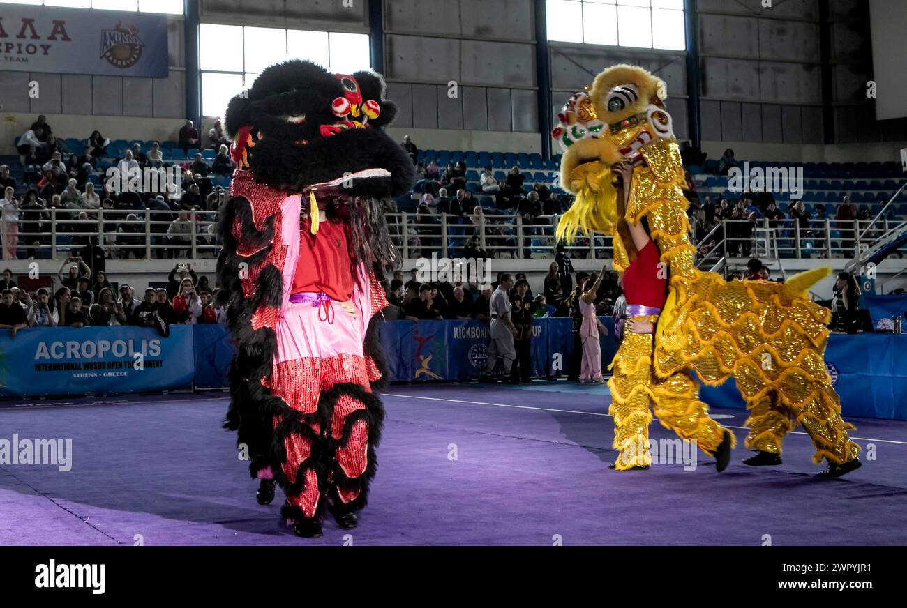 Greece, Greece. 9th Mar, 2024. Artists perform lion dance during the opening ceremony of the Acropolis-Forbidden City International Wushu Tournament in Athens, Greece, on March 9, 2024. Credit: Panagiotis Moschandreou/Xinhua/Alamy Live News Stock Photo