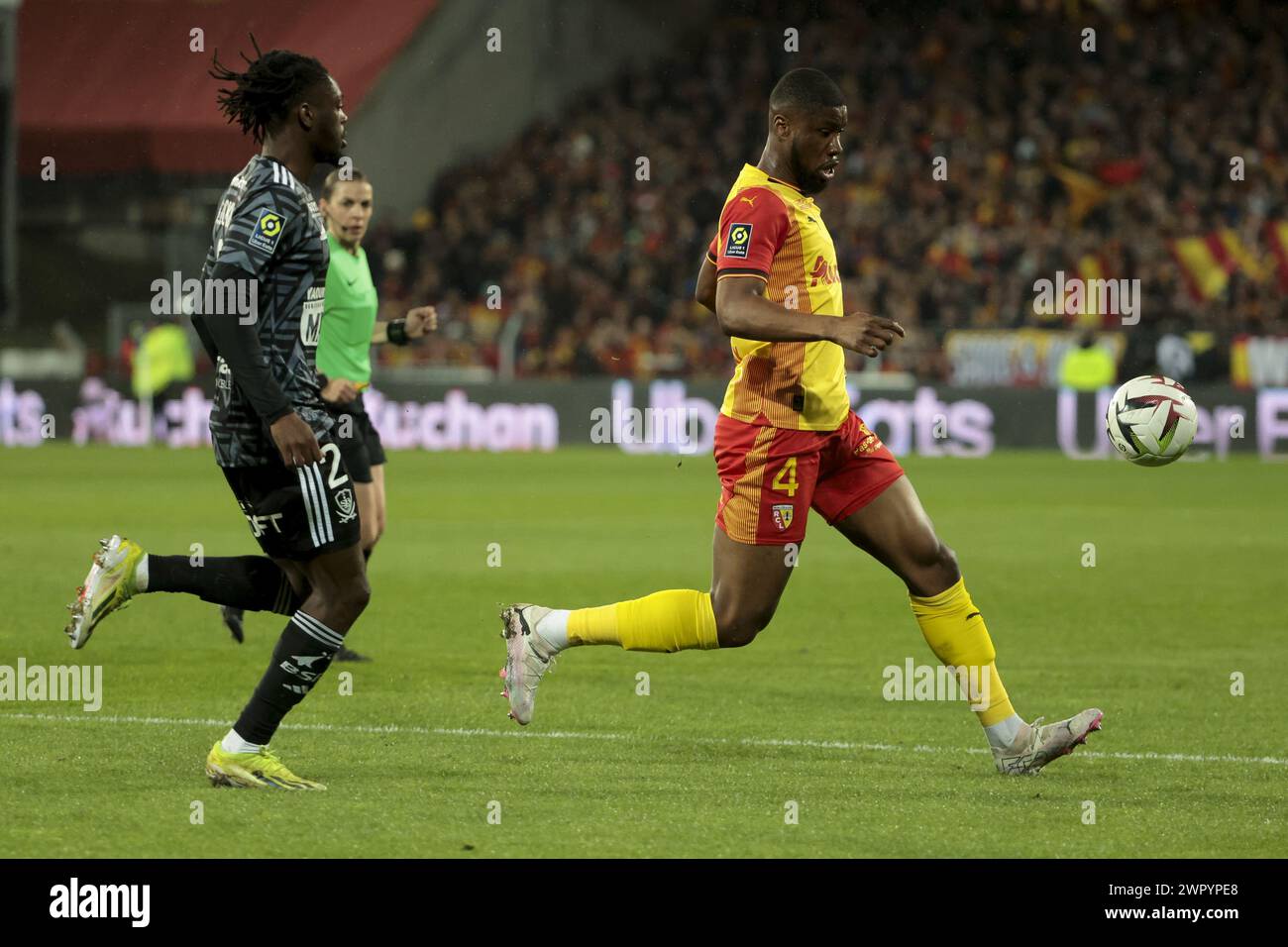 Kevin Danso of Lens, left Banzouzi Bradley Locko of Brest during the French championship Ligue 1 football match between RC Lens and Stade Brestois on March 9, 2024 at Bollaert Delelis stadium in Lens, France Stock Photo