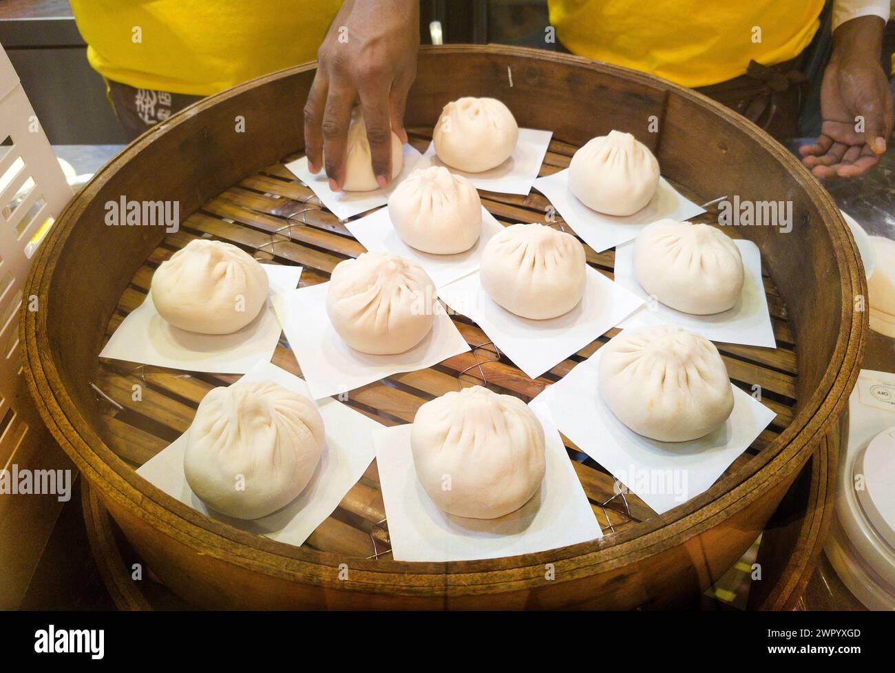 Traditional oriental Bao Buns in bamboo steamer Stock Photo