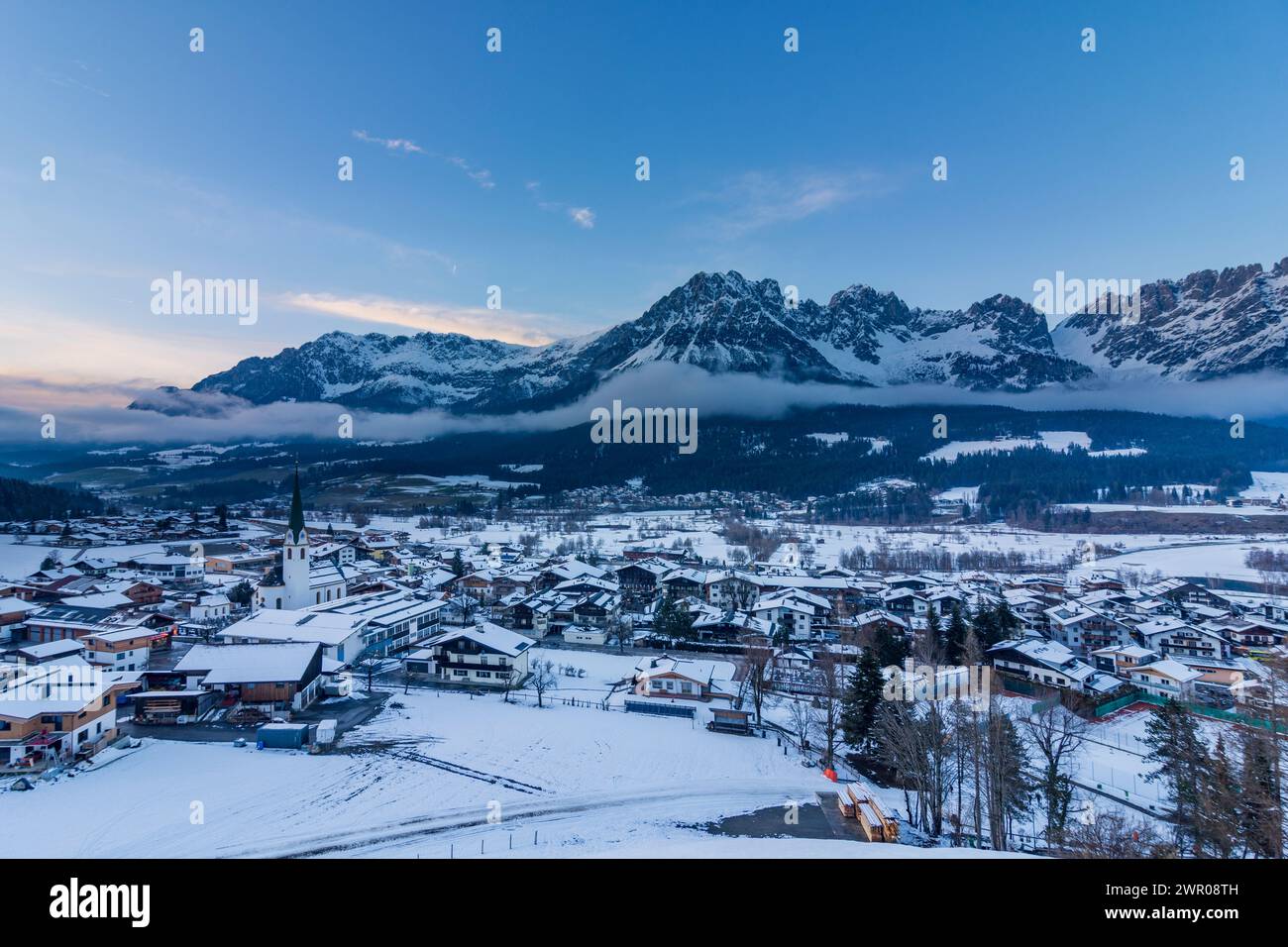 Ellmau: village Ellmau with church, Wilder Kaiser mountain range, snow ...