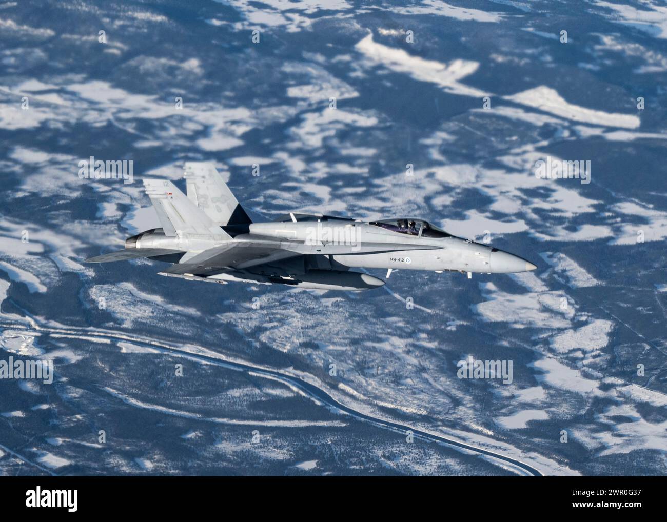 A Finnish Air Force F/A-18C Hornet flies next to a U.S. KC-135 Stratotanker from the 100th Air Refueling Wing, Royal Air Force Mildenhall, England Stock Photo