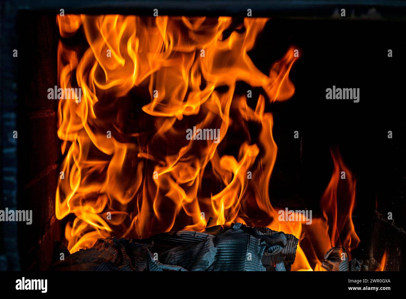orange fire flames on a dark background. Disasters, fires, natural disasters. Ecological catastrophy Stock Photo