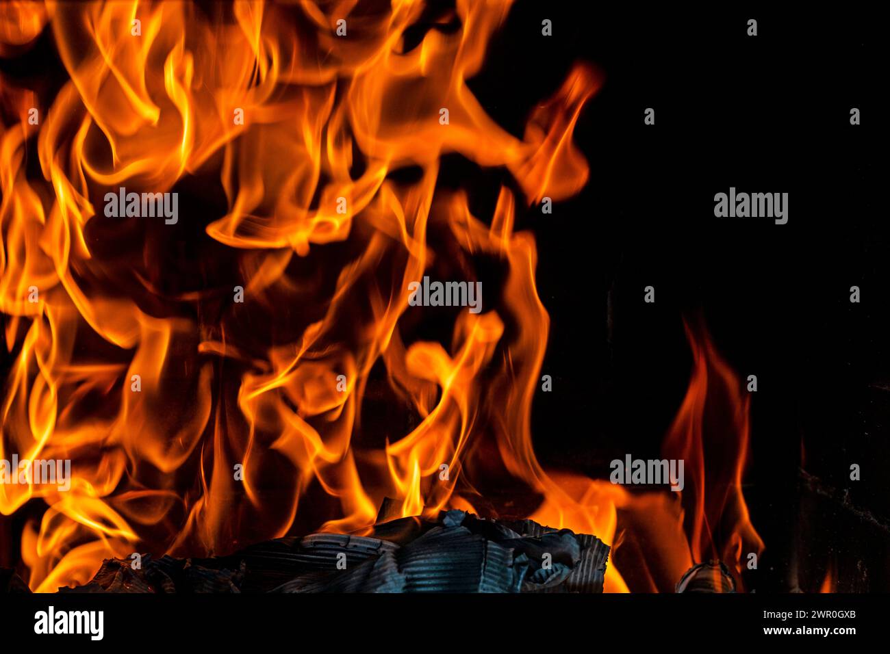 orange fire flames on a dark background. Disasters, fires, natural disasters. Ecological catastrophy Stock Photo