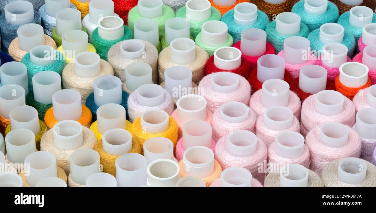 Sewing Thread. Set of different colorful sewing threads as background, top view Stock Photo