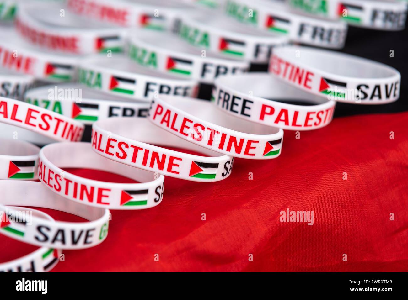 Wristbands for Pro Palestine protest march in London, UK, protesting against the conflict in Gaza and against Israel occupation and military actions. Stock Photo