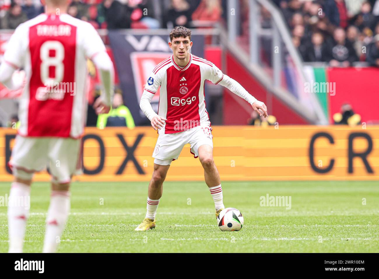 AMSTERDAM, NETHERLANDS - MARCH 10: Ahmetcan Kaplan of AFC Ajax dribbles during the Dutch Eredivisie match between Ajax and Fortuna Sittard at Johan Cruijff ArenA on March 10, 2024 in Amsterdam, Netherlands. (Photo by Peter Lous/Orange Pictures) Stock Photo