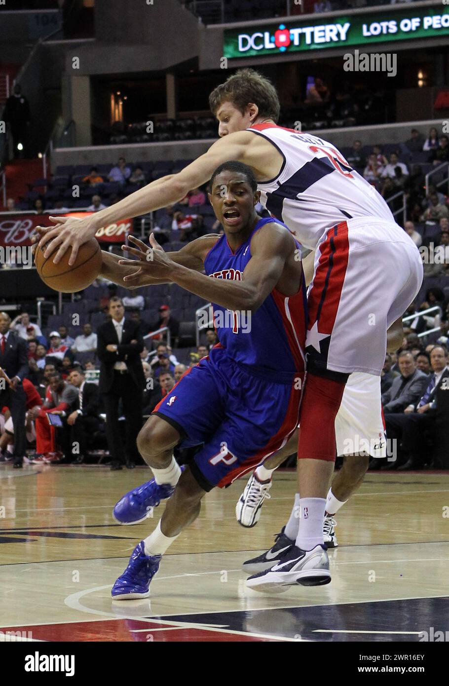 March 26 2012:  Jan Vesely (24) of the Washington Wizards reaches in t oget the ball from  Brandon Knight (7)  of the Detroit Pistons during an NBA game at Verizon Center, in Washington DC. Pistons won 79-77. Stock Photo