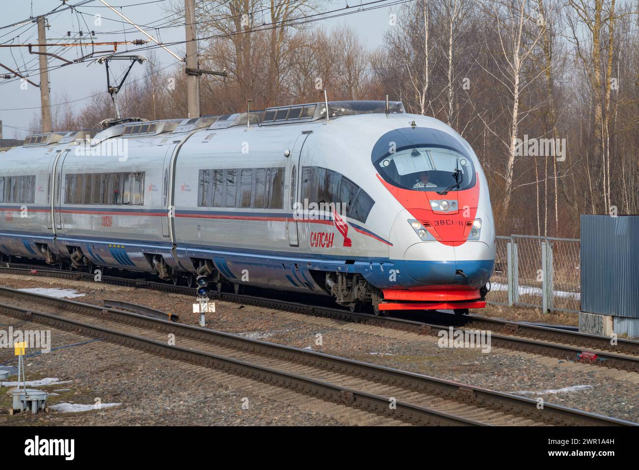SLAVYANKA, RUSSIA - MARCH 04, 2024: High-speed electric train EVS1-11 'Sapsan' on a March day. Oktyabrskaya Railway Stock Photo