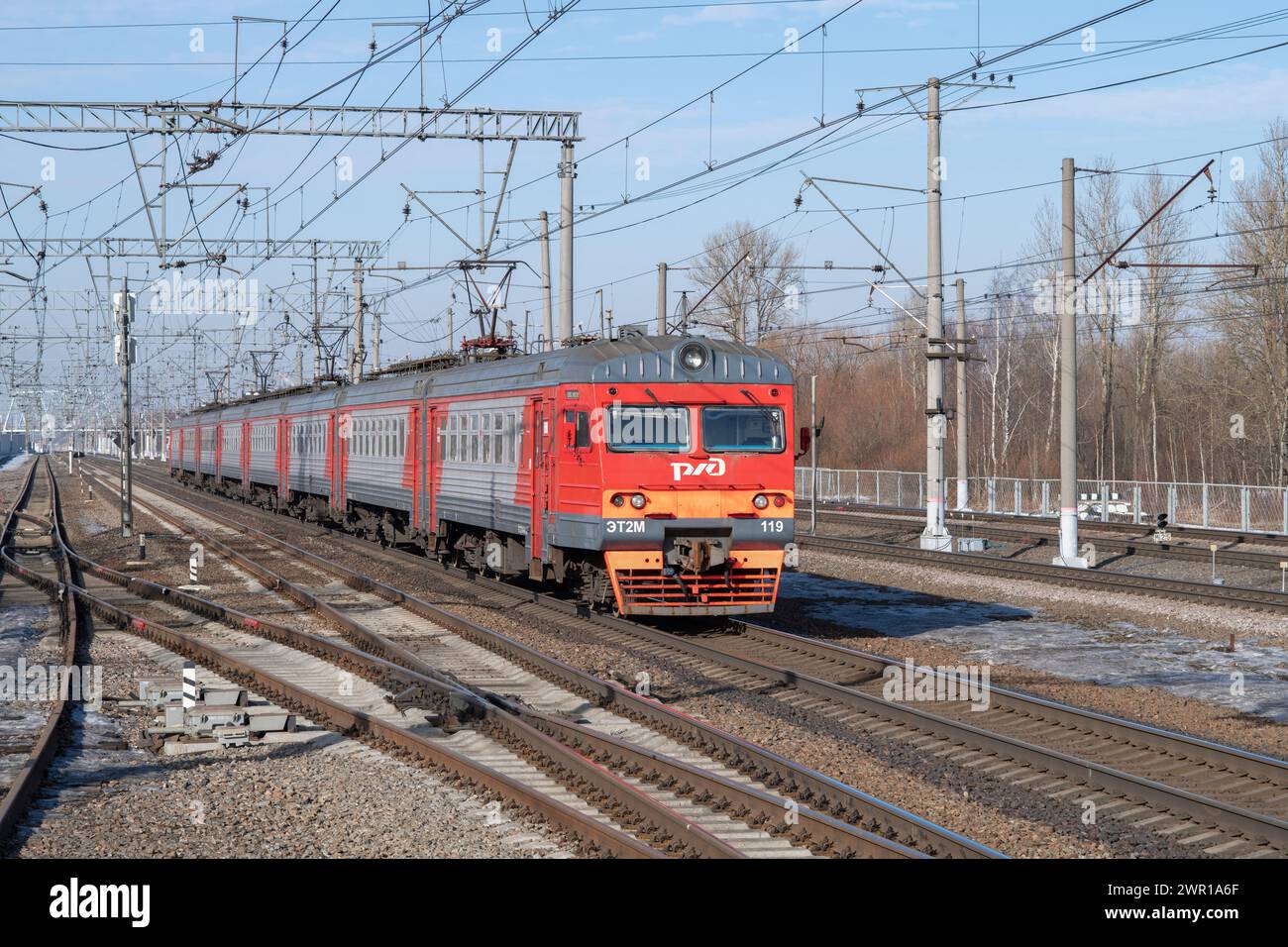 SLAVYANKA, RUSSIA - MARCH 04, 2024: Suburban electric train ET2M-119 on a sunny March day. Oktyabrskaya Railway Stock Photo
