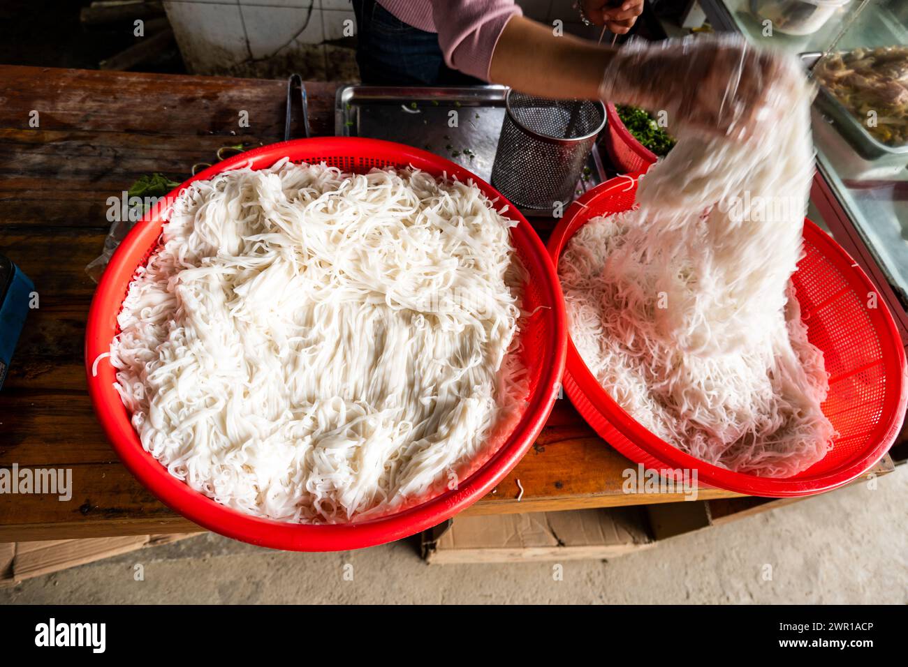 Vietnamese rice noodles for Pho preparation in street food stall Stock