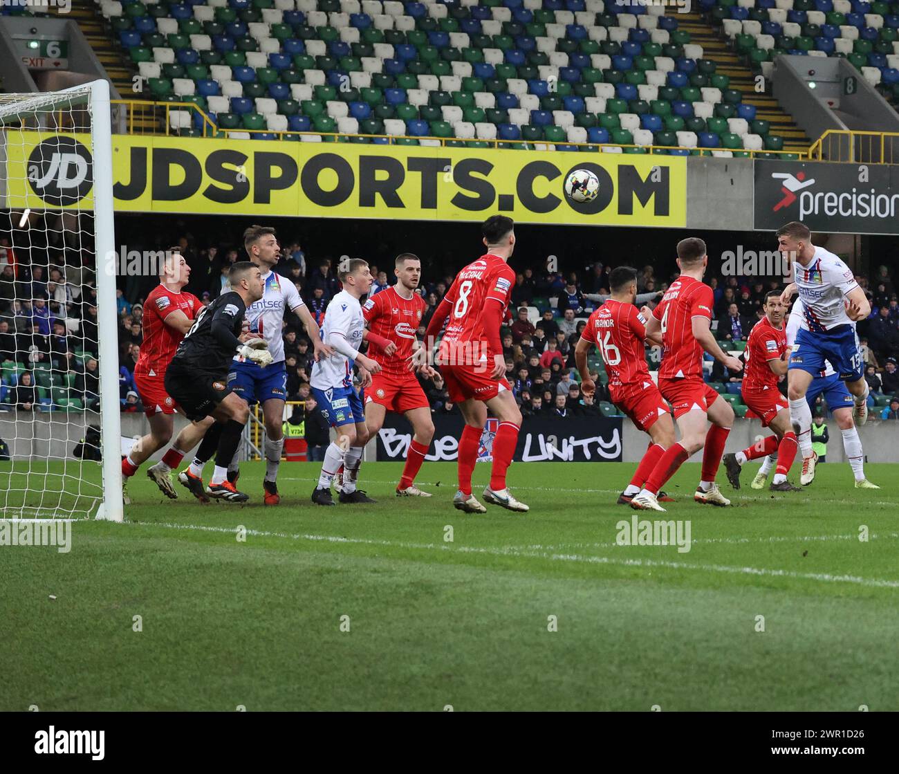 National Football Stadium at Windsor Park, Belfast, Northern Ireland, UK. 10th Mar 2024. BetMcLean League Cup Final – Linfield v Portadown. (Linfield in white). Action from today's final. Ben Hall (15) heads Linfield ahaed and celebrates. Credit: CAZIMB/Alamy Live News. Stock Photo