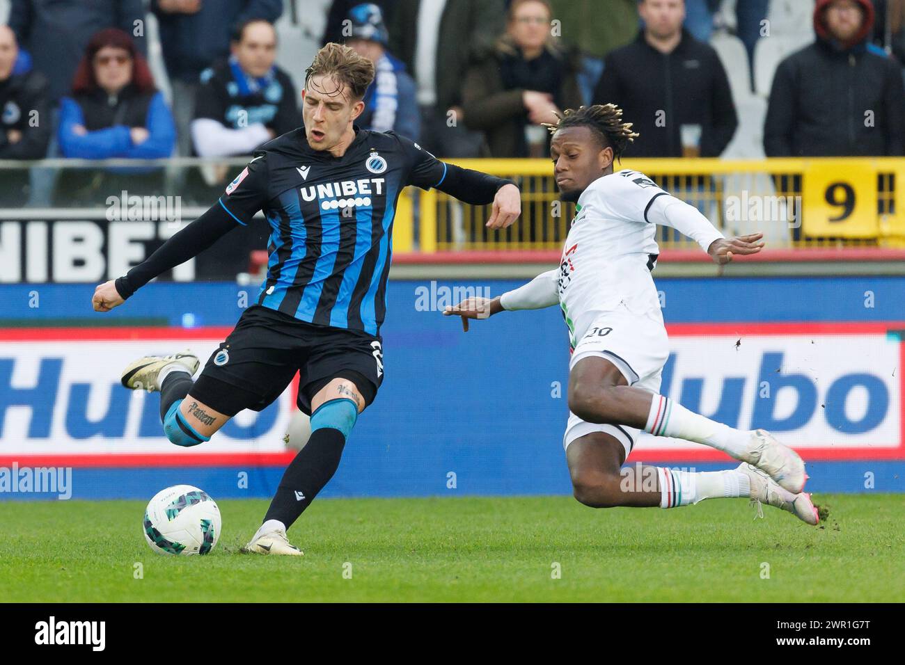 Club's Michal Skoras and OHL's Hamza Mendyl fight for the ball during a soccer match between Club Brugge and Oud-Heverlee Leuven, Sunday 10 March 2024 in Brugge, on day 29 of the 2023-2024 season of the 'Jupiler Pro League' first division of the Belgian championship. BELGA PHOTO KURT DESPLENTER Stock Photo