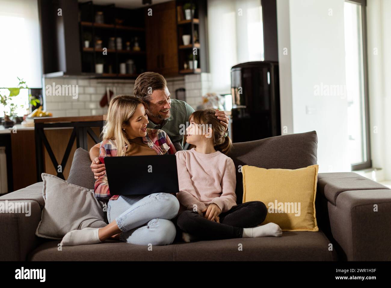 Joyful family three spends quality hi-res stock photography and images ...