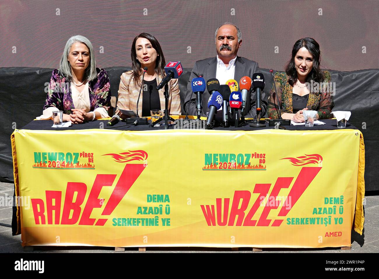 Democratic Society Congress (DTK) Co-Chair Berdan Ozturk (L3), Peoples' Equality and Democracy Party (DEM Party) Co-Chair Tulay Hatimogullari (L2), Democratic Regions Party (DBP) Co-Chair Cigdem Kilicgun Ucar (L1) and Free Women's Movement (Tevgera Jinen Azad) TJA activist Dilan Guvenc (L4) are seen attending the announcement of the Newroz 2024 declaration at Diyarbakir Dicle Firat Kurdish Cultural Association. Kurdish political parties and organizations representing a large part of the Kurds living in Turkey have announced the declaration of the Newroz festival for 2024 and started the celebr Stock Photo