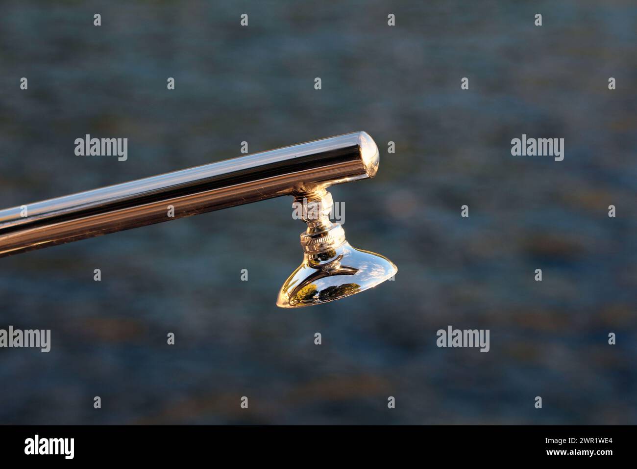 Shiny inox metal public shower on sea beach with small fixed shower ...