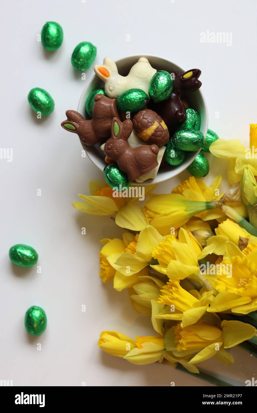 Chocolate candies and daffodils. Springtime holidays concept Stock ...