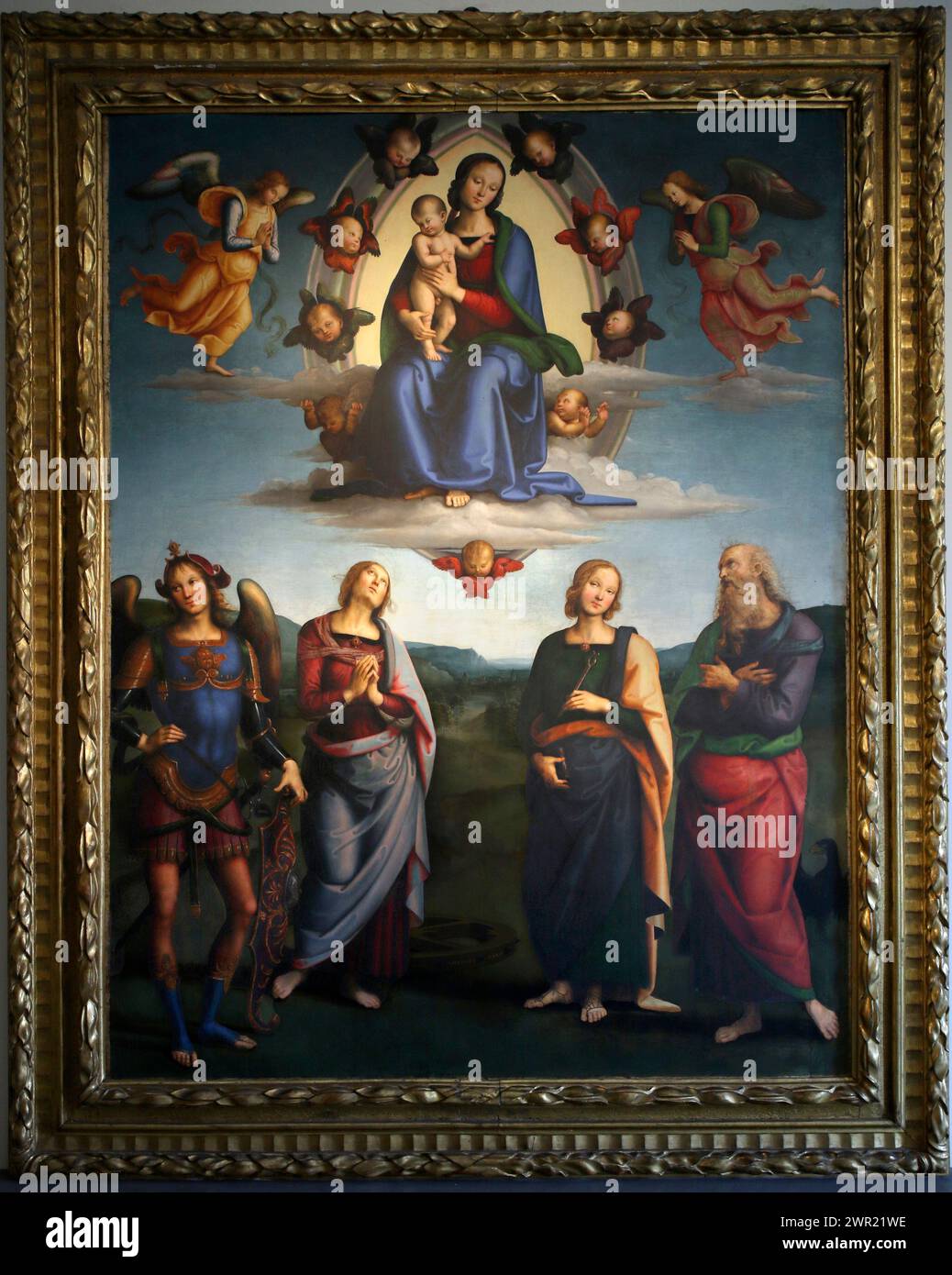 Italy Emilia Romagna Bologna - National Art Gallery - Madonna and Child in Glory and Saints John the Baptist, Apollonia, Catherine of Alexandria, and Michael the Archangel by  Vannucci Pietro known as Perugino in 16th century Stock Photo