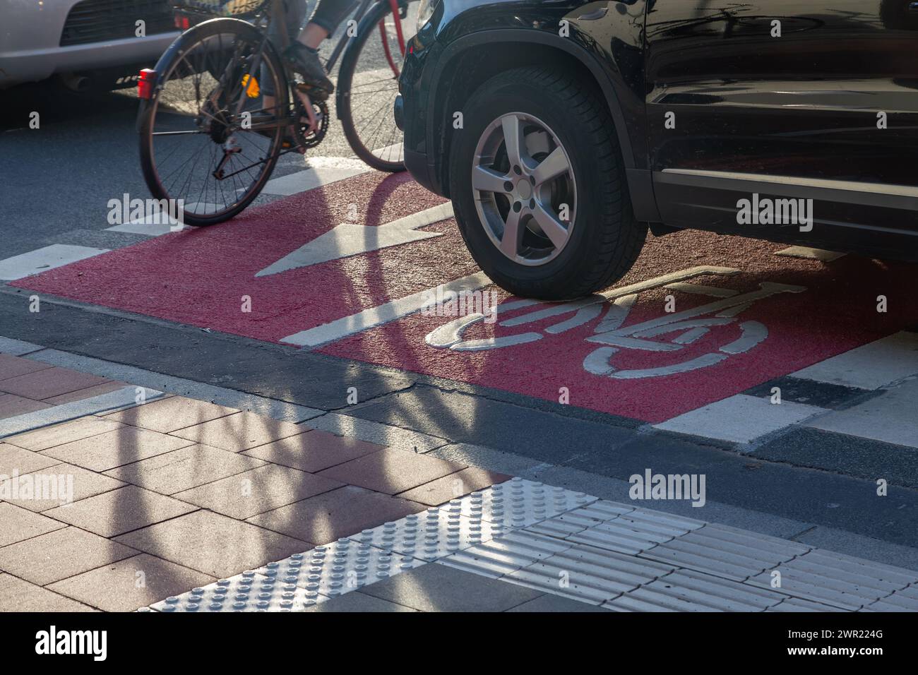 Reckless driver blocks the bike path Stock Photo