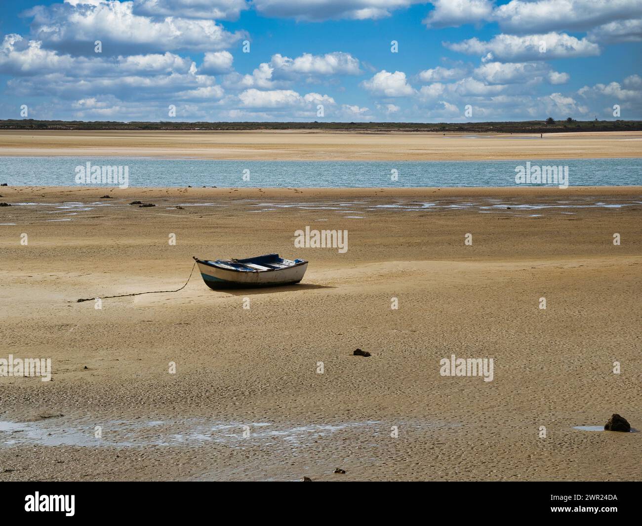 Rustic Old Boat Anchored on Sandy Beach at Low Tide Stock Photo - Alamy