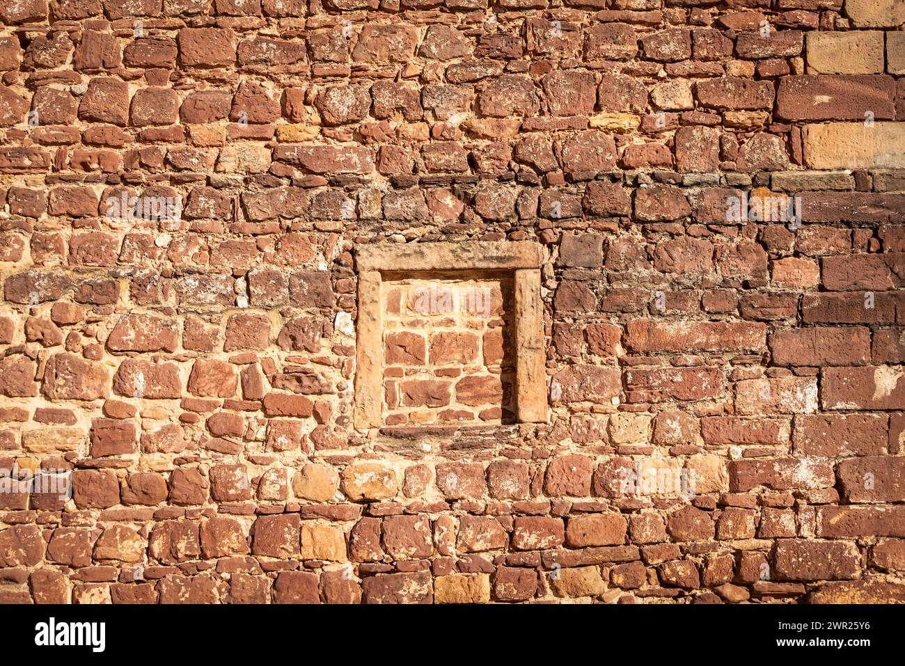 old red stone and brick wall, historical building Stock Photo