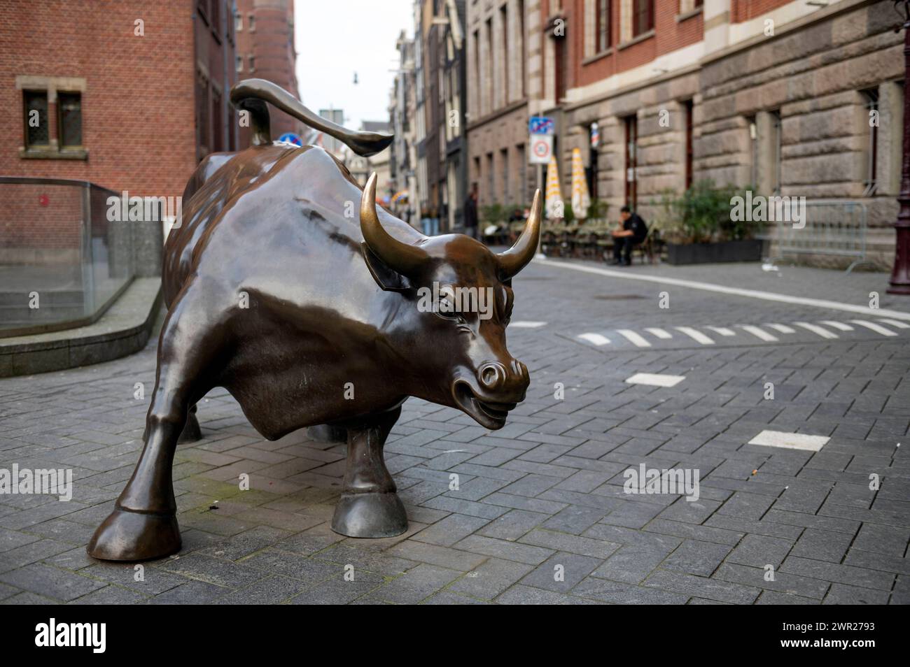 Amsterdam The Netherlands 10th March 2024 On the Beursplein in Amsterdam the Charging Bull statue between the Beurs van Berlage and the AEX stock exchange Beursplein 5. sculpture, statue, Stock Photo