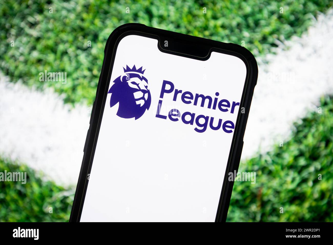 In this photo illustration, a Premier League logo seen displayed on a smartphone. Stock Photo