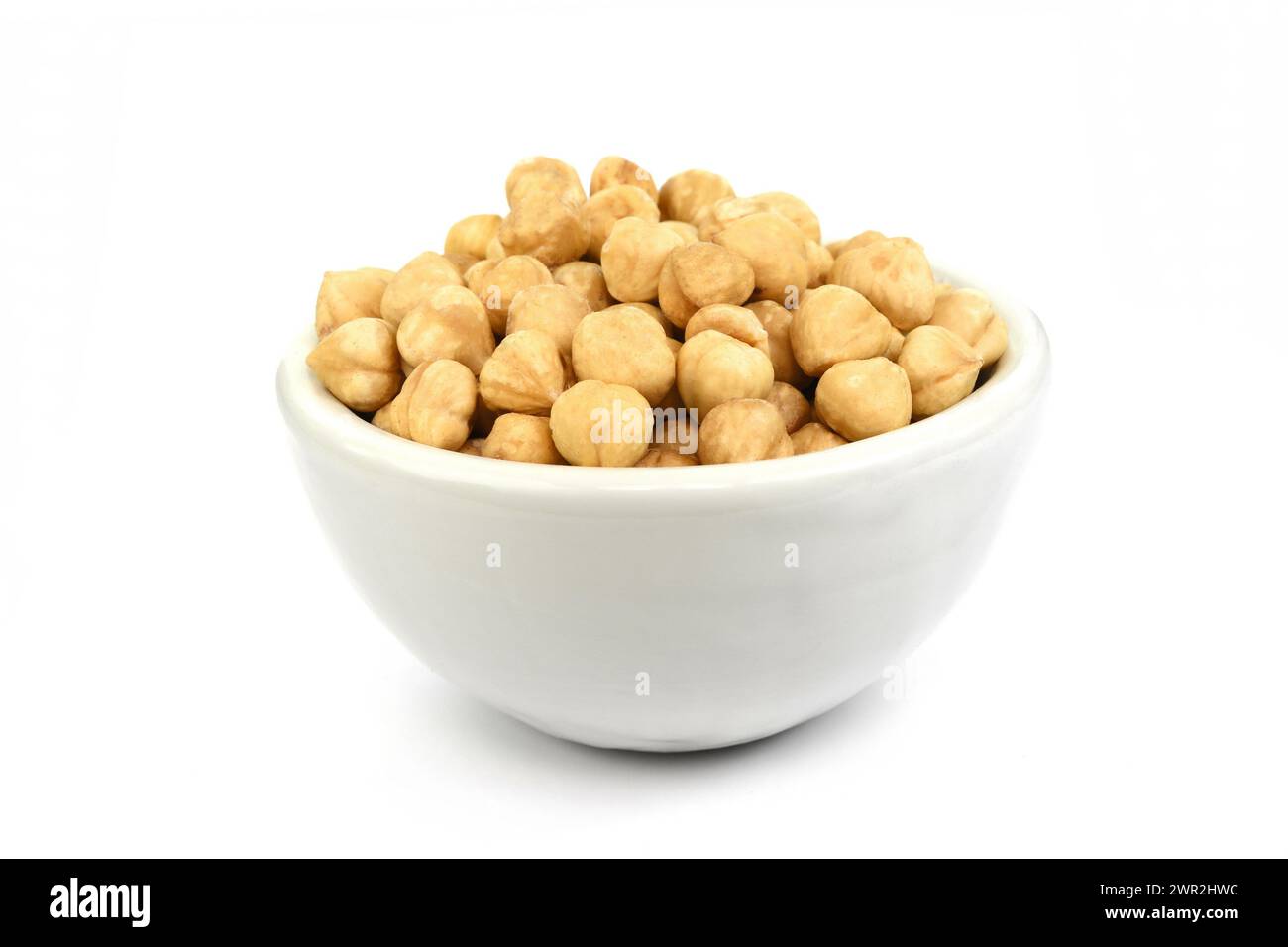 Bowl of peeled hazelnuts isolated on white background. Package design ...