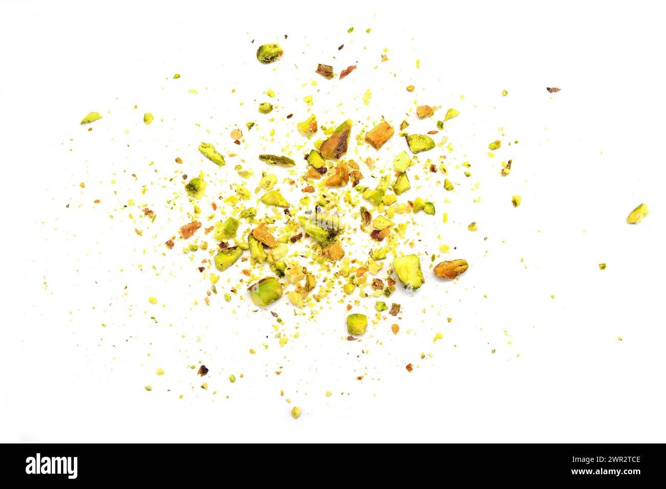 Ground, milled, crushed or granulated pistachio pile isolated on white background Stock Photo