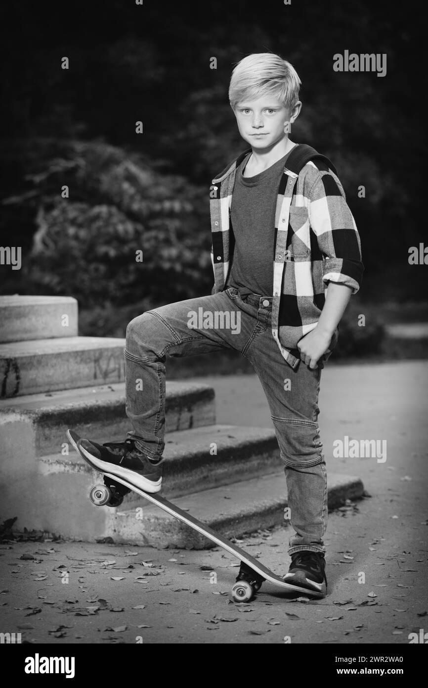 Young boy posing outdoor in skate park for monochrome book photos Stock Photo