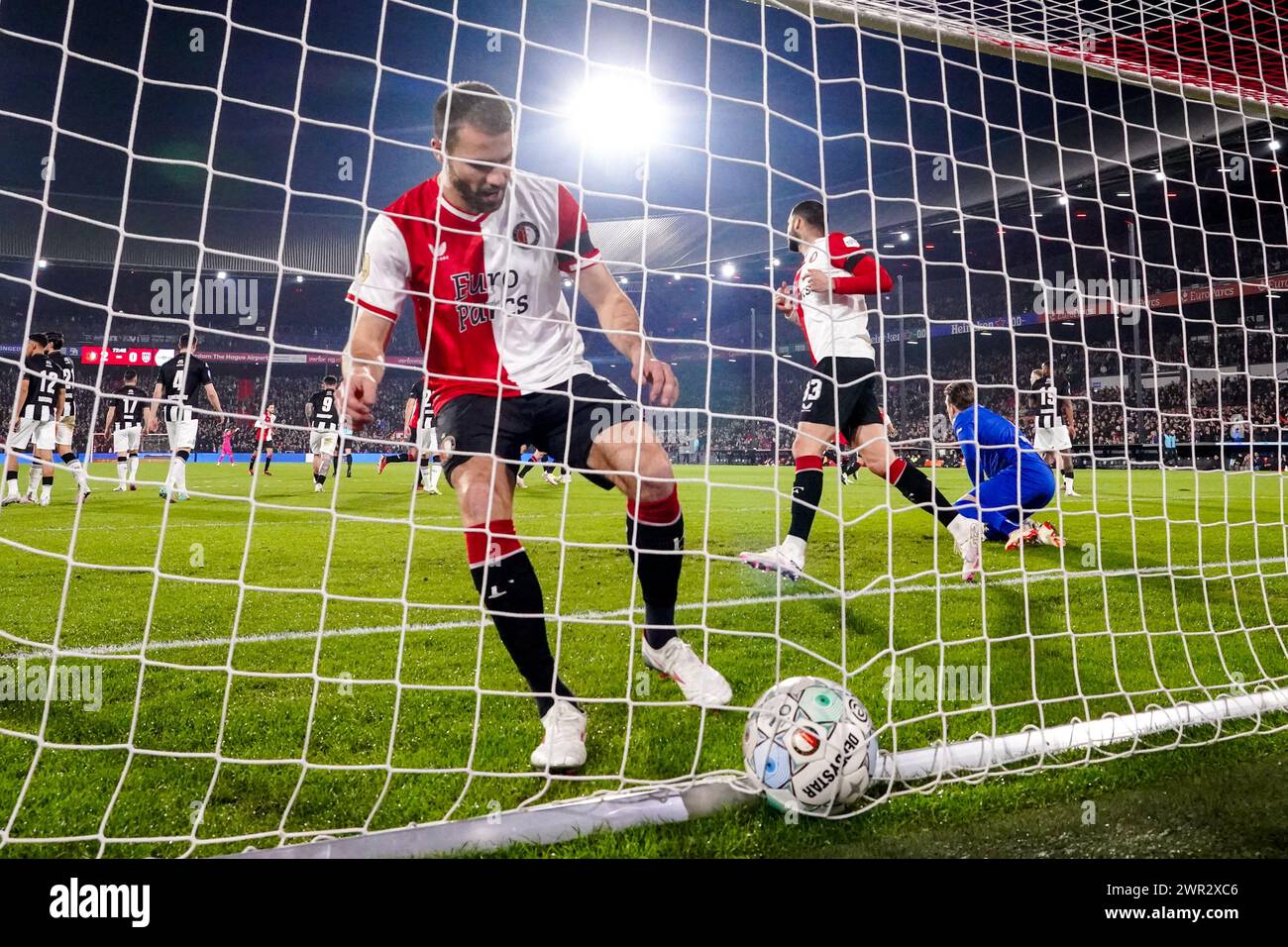 Rotterdam, Netherlands. 10th Mar, 2024. ROTTERDAM, NETHERLANDS - MARCH 10: Bart Nieuwkoop of Feyenoord grabs the ball from the goal during the Dutch Eredivisie match between Feyenoord and Heracles Almelo at Stadion Feyenoord on March 10, 2024 in Rotterdam, Netherlands. (Photo by Joris Verwijst/Orange Pictures) Credit: Orange Pics BV/Alamy Live News Stock Photo