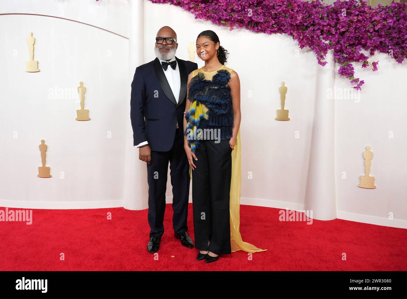 David Alan Grier, left, and Luisa Danbi GrierKim arrive at the Oscars