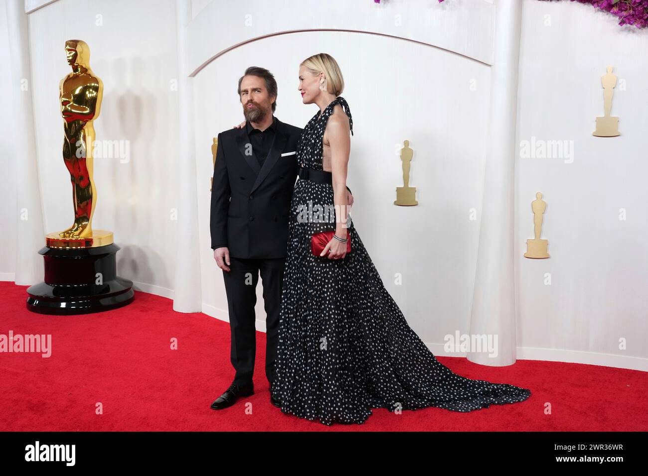 Sam Rockwell, left, and Leslie Bibb arrive at the Oscars on Sunday