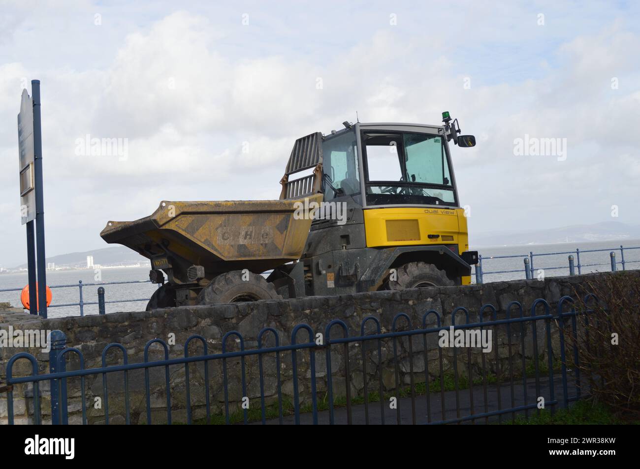 Dump Truck on the Mumbles Promenade, as part of the Mumbles Coastal Defence Project. Mumbles, Swansea, Wales, United Kingdom. 19th February 2024. Stock Photo