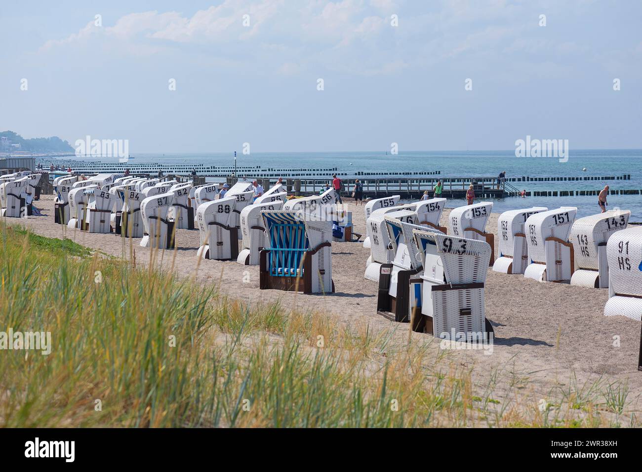 Beach chairs on the beach, behind groynes, Kuehlungsborn, Mecklenburg-Vorpommern, Germany Stock Photo