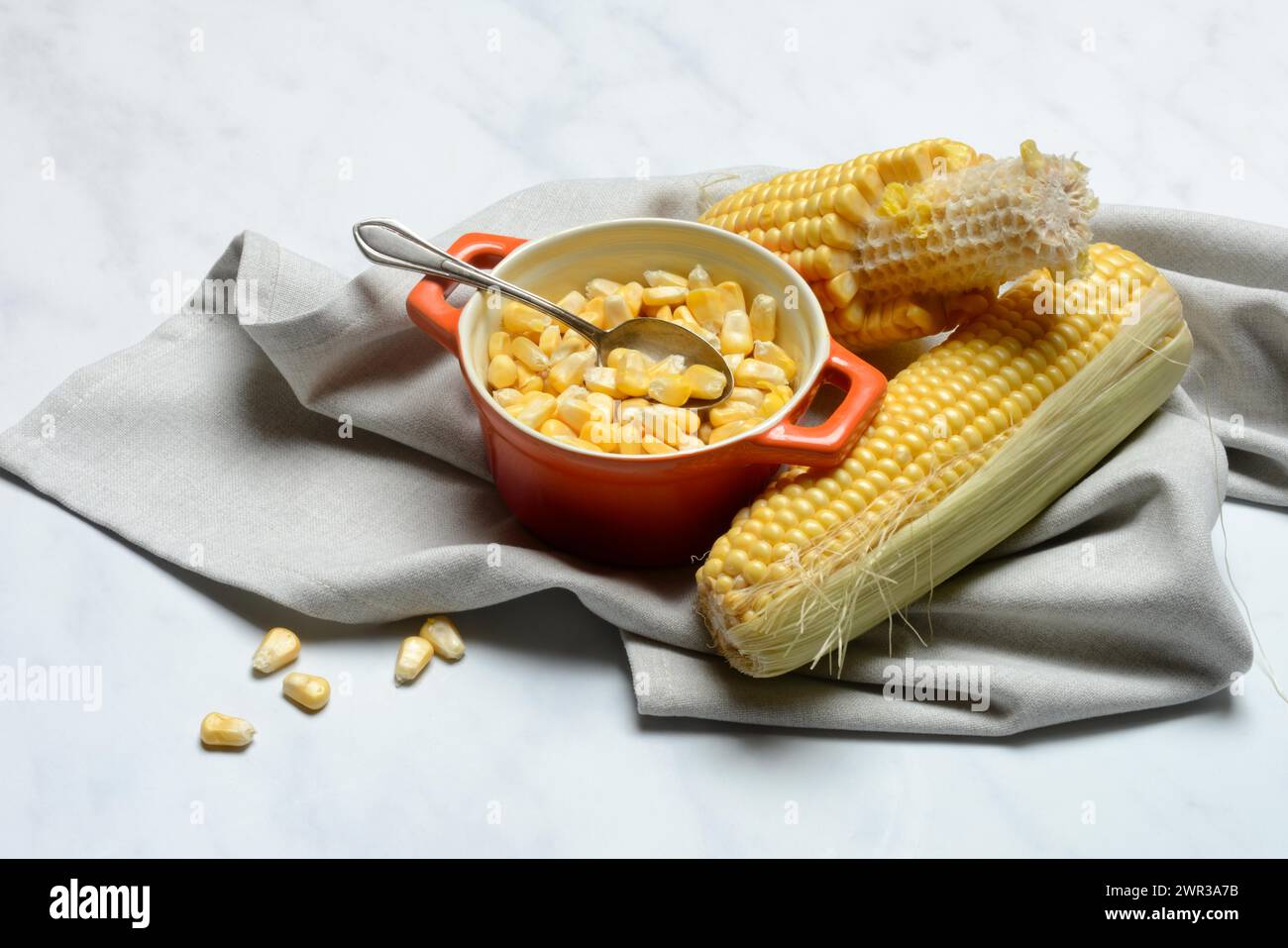 Fresh maize kernels in pots and cobs, corn (Zea mays) Stock Photo