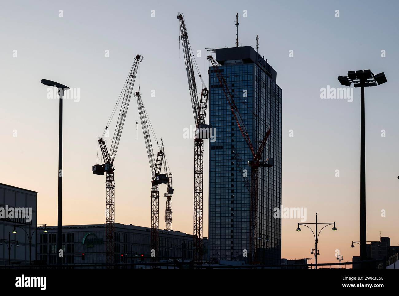 Cranes at the construction site of the Covivio high-rise, next to the Park Inn by Radisson Berlin hotel on Alexanderplatz, 08/03/2024 Stock Photo