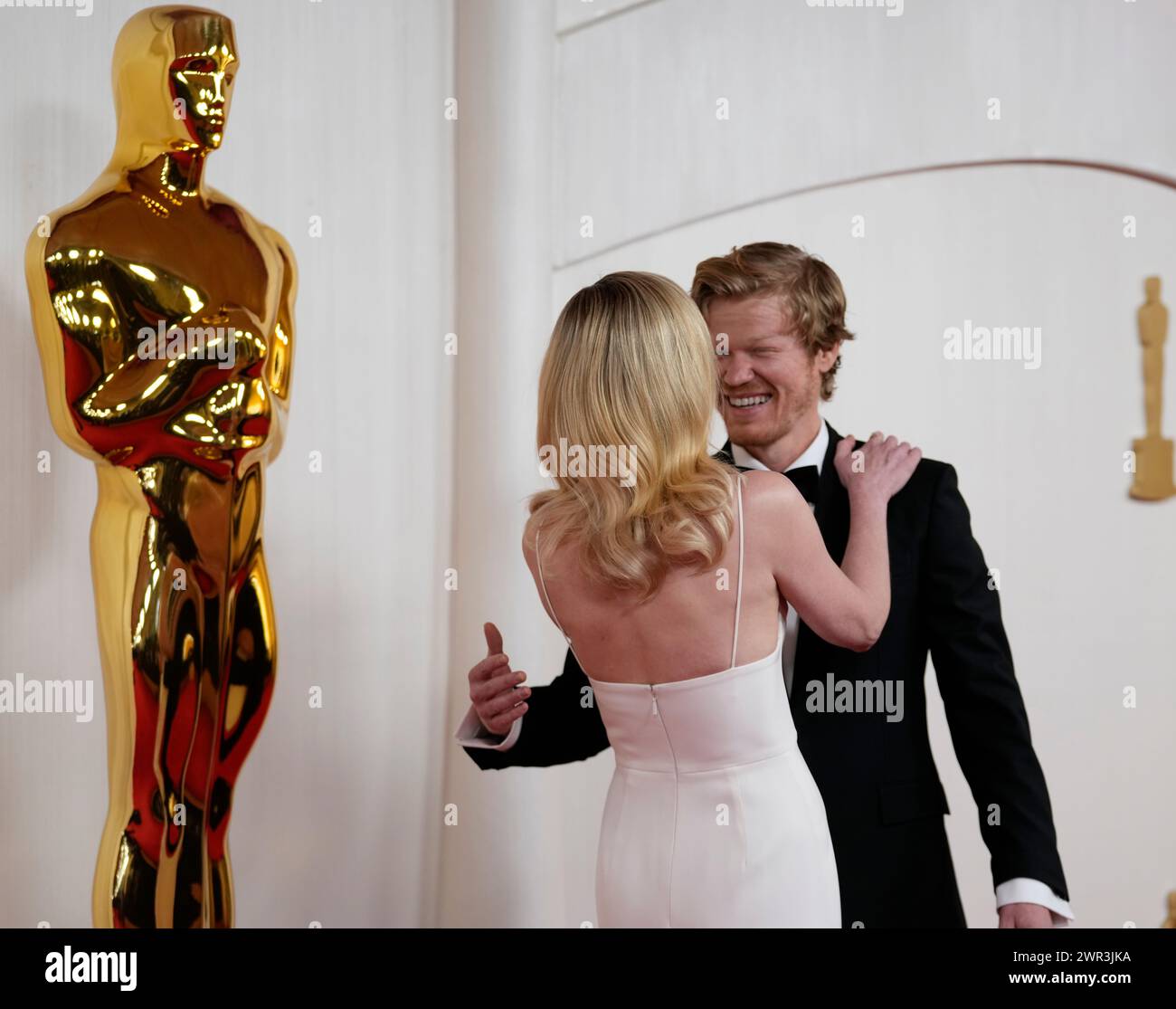 Kirsten Dunst, left and Jesse Plemons arrive at the Oscars on Sunday
