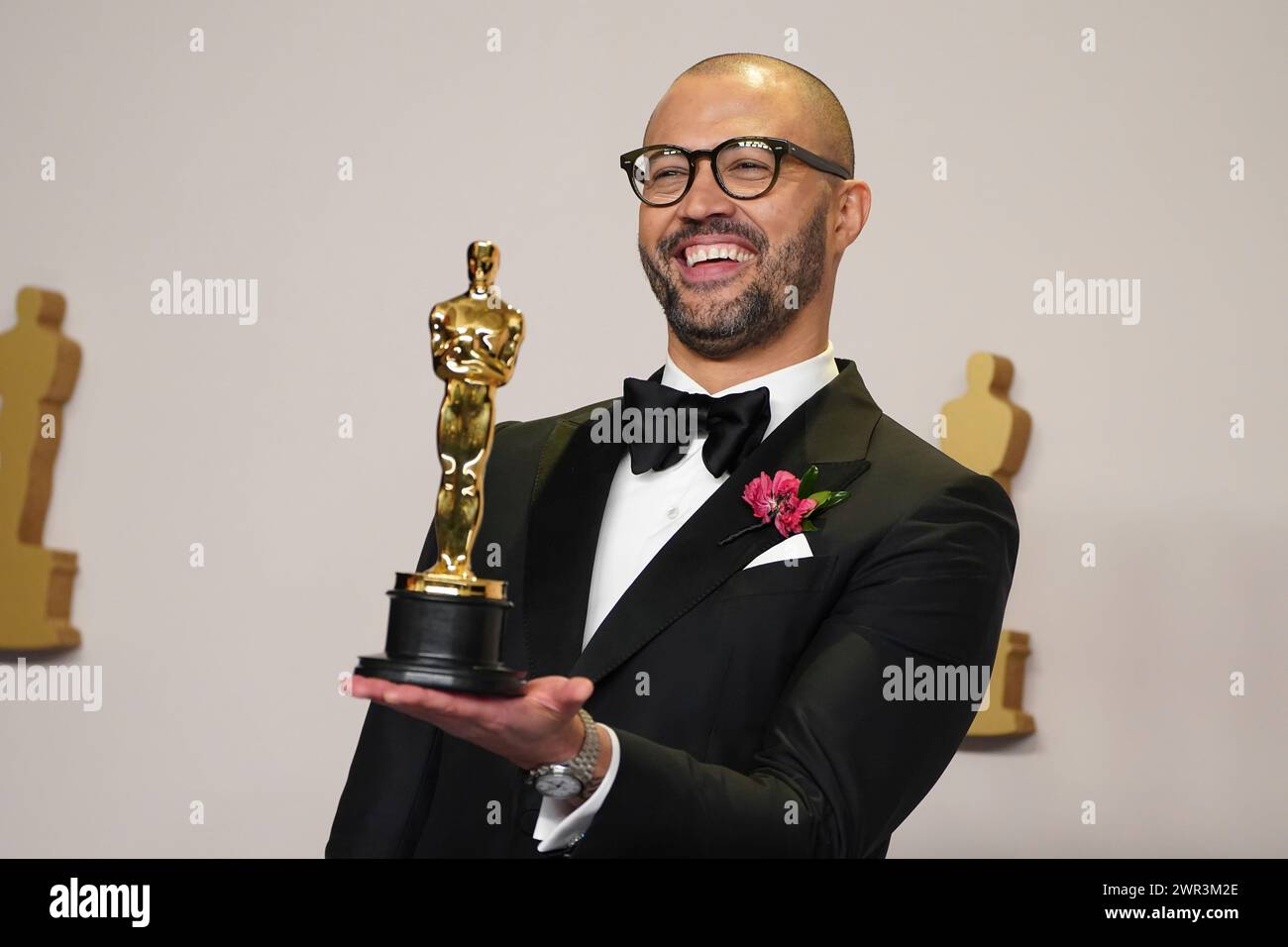Cord Jefferson poses with the award for best adapted screenplay for