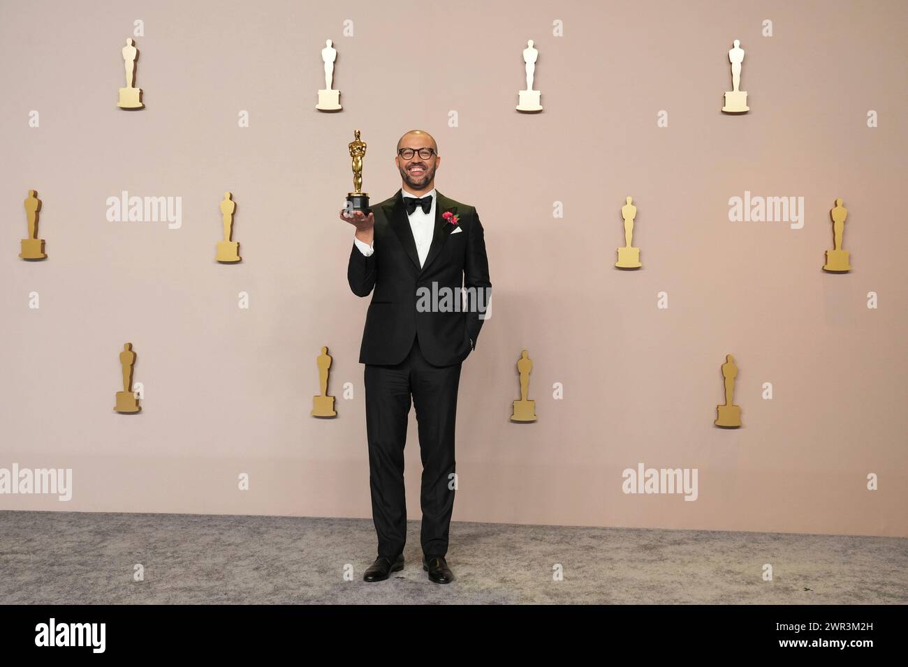 Cord Jefferson poses with the award for best adapted screenplay for(02)