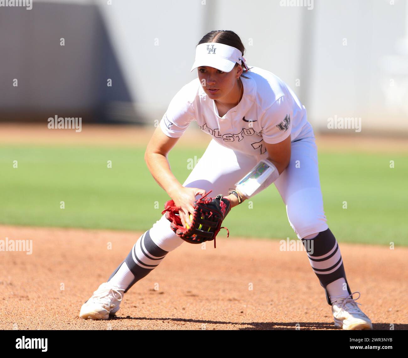 March 10, 2024: Houston infielder Mandy Esman (7) fields a ground ball during an NCAA softball game between the Houston Cougars and the Texas Longhorns on March 10, 2024. Texas won, 8-6, and took the series two games to one. (Credit Image: © Scott Coleman/ZUMA Press Wire) EDITORIAL USAGE ONLY! Not for Commercial USAGE! Stock Photo