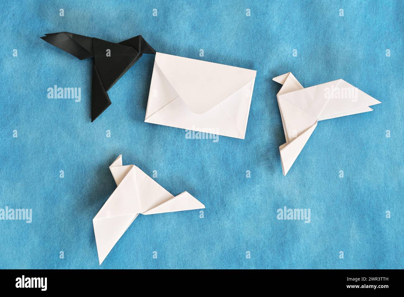 Parcel Origami Paper origami of black raven stealing a white envelope letter from ...