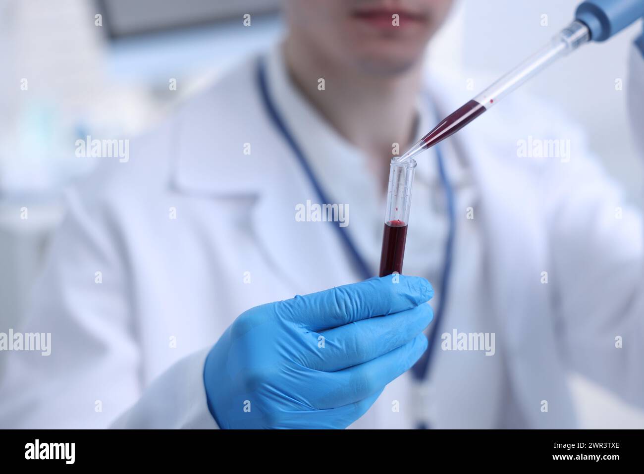 Sample Lab Dripper Scientist dripping sample into test tube in laboratory, closeup Stock ...